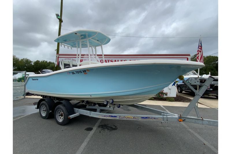 2023 Tidewater 220 CC Adventure boat on trailer, displayed outdoors.