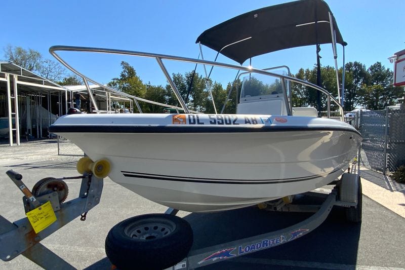 2008 Sea Boss 190 Center Console boat on trailer, parked outdoors under clear sky.
