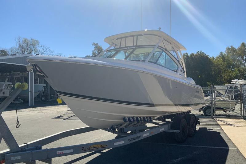 2027 Pursuit D 266 Denali boat on trailer in sunny outdoor setting.