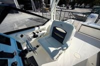 2027 Cobia 250 Dual Console boat interior with helm seat and steering wheel.
