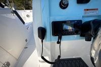 Control panel of 2027 Cobia 250 Dual Console boat with Garmin device.