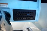 Control panel of 2027 Cobia 250 Dual Console boat with labeled switches.