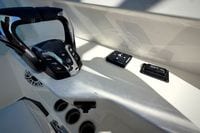 Control panel of 2027 Cobia 250 Dual Console boat with throttle and switches.