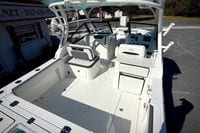 2027 Cobia 250 Dual Console boat interior with seating and helm station.