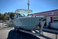 2027 Cobia 250 Dual Console boat on trailer at dealership.