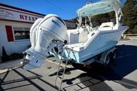 2027 Cobia 250 Dual Console boat with Yamaha engine on trailer.
