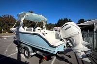 2027 Cobia 250 Dual Console boat with Yamaha engine on trailer in sunny outdoor setting.