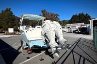 2027 Cobia 250 Dual Console boat with twin Yamaha engines at a boat sales lot.