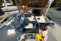 2007 Clearwater 1900 Baystar boat dashboard with steering wheel and navigation equipment.