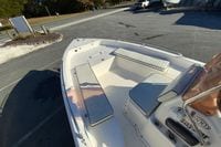 2007 Clearwater 1900 Baystar boat with cushioned seating, parked outdoors.