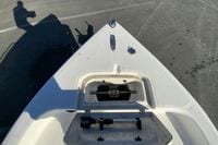 Bow view of a 2007 Clearwater 1900 Baystar boat on pavement.