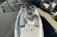 2007 Clearwater 1900 Baystar boat with seating, parked outdoors.