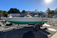 2007 Clearwater 1900 Baystar boat on trailer at dealership under sunny sky.