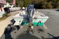 2007 Clearwater 1900 Baystar boat with outboard motor in a parking lot.