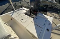 2013 Pathfinder 2200 TRS boat with outboard motor and storage compartments.