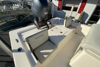 2013 Pathfinder 2200 TRS boat with outboard motor and seating area.