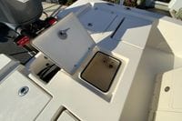 2013 Pathfinder 2200 TRS boat with open storage compartment and Yamaha engine.