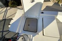 Open storage compartment on a 2013 Pathfinder 2200 TRS boat, showing interior details.