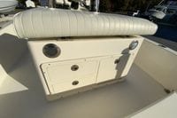 2013 Pathfinder 2200 TRS boat seat and storage compartment in sunlight.
