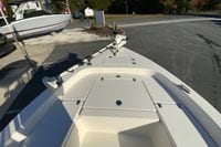2013 Pathfinder 2200 TRS boat with trolling motor, parked on a paved surface.