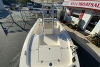 2013 Pathfinder 2200 TRS boat at dealership, featuring spacious deck and modern design.