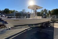 2013 Pathfinder 2200 TRS boat on trailer, parked outdoors under bright sunlight.