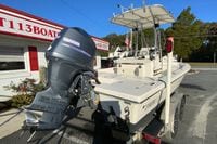 2013 Pathfinder 2200 TRS boat with Yamaha outboard motor, parked outside dealership.