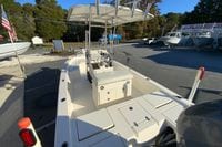 2013 Pathfinder 2200 TRS boat with T-top, parked at a dealership.