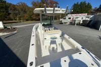 2017 Everglades 253 Center Console boat at dealership, showcasing spacious deck and seating.