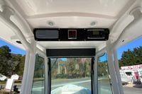 2017 Everglades 253 Center Console boat interior with control panel and overhead electronics.