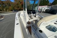2017 Everglades 253 Center Console boat interior at dealership, featuring helm and seating.