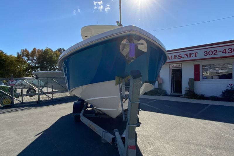 2017 Everglades 253 Center Console boat on trailer in sunny dealership lot.