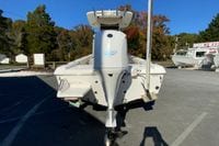 2017 Everglades 253 Center Console boat with powerful outboard motor, parked outdoors.