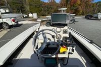 2009 Hewes Redfisher 18 boat dashboard with steering wheel and navigation equipment.