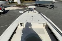 2009 Hewes Redfisher 18 boat, front deck view, parked on a trailer in a lot.