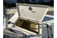 Open storage compartment on a 2009 Hewes Redfisher 18 boat.