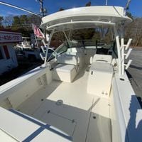 2025 Cobia 280 Dual Console boat with spacious deck and seating area.