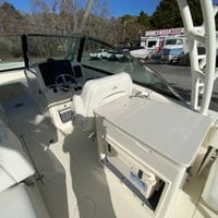 2025 Cobia 280 Dual Console boat interior with helm and seating area.