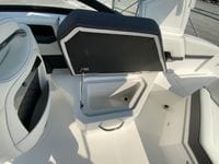 2026 Cobalt R4 OB boat interior with open storage compartment and sleek seating design.