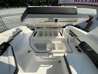 2026 Cobalt R4 OB boat with open storage compartments and seating area.