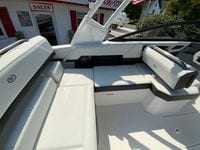 2026 Cobalt R4 OB boat interior with white seating, displayed at a sales location.