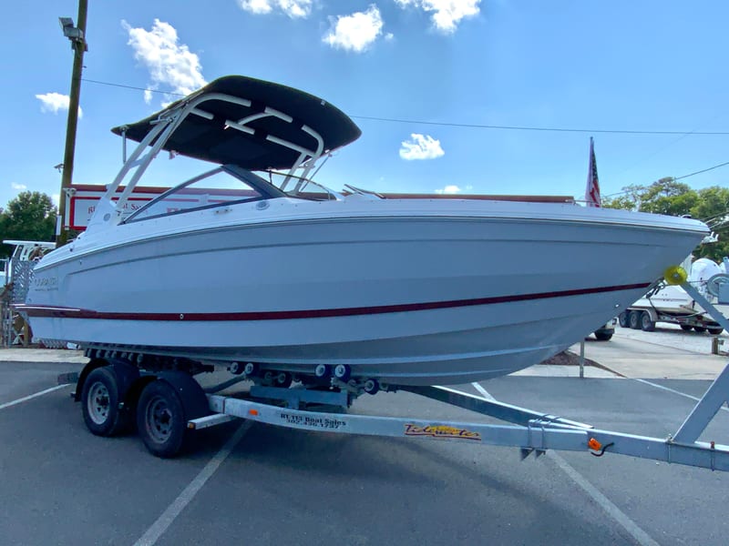 2026 Cobalt R4 OB boat on trailer under blue sky.