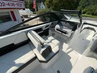 2026 Cobalt R4 OB boat interior with sleek white seating and modern dashboard design.