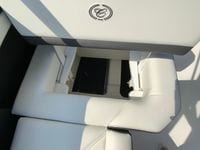 2026 Cobalt R4 OB boat seat storage compartment with logo.