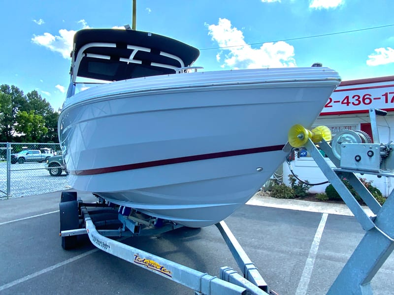 2026 Cobalt R4 OB boat on trailer, parked outdoors under a clear sky.