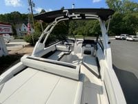 2026 Cobalt R4 OB boat with spacious seating and sleek design, parked outdoors.