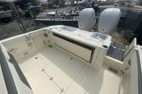 2026 Cobia 305 Center Console boat interior with dual engines and spacious deck.