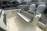 2026 Cobia 305 Center Console boat with foldable seating and dual Yamaha engines.