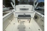 2026 Cobia 305 Center Console boat interior with seating and storage compartments.