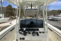 2026 Cobia 305 Center Console boat dashboard with steering wheel and controls.